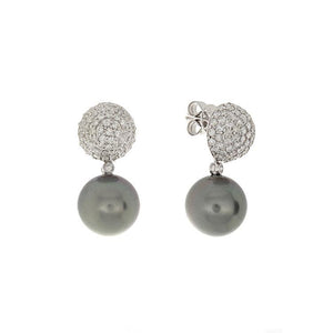 These earrings feature a cluster of round brilliant cut diamonds th...