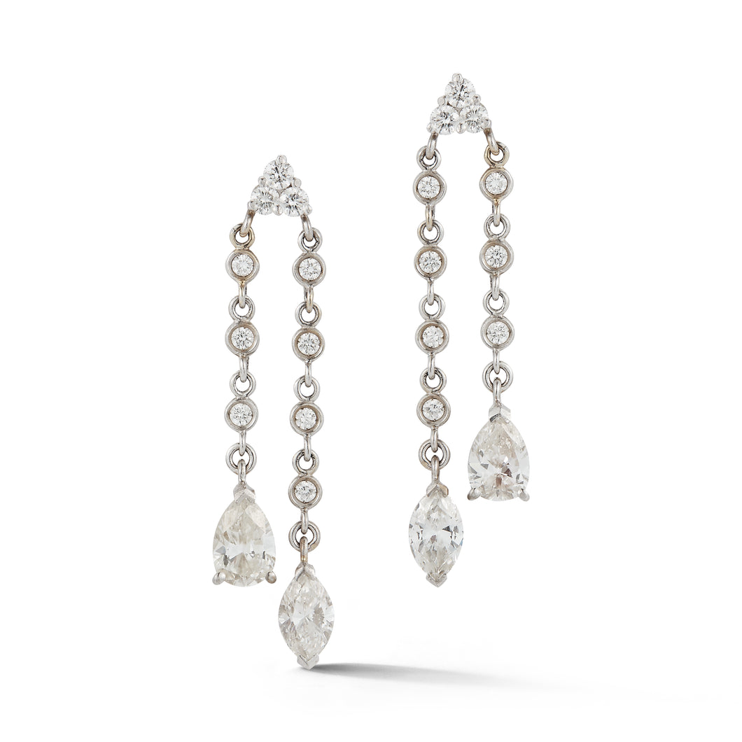 These estate earrings feature round, pear and marquise diamonds tha...