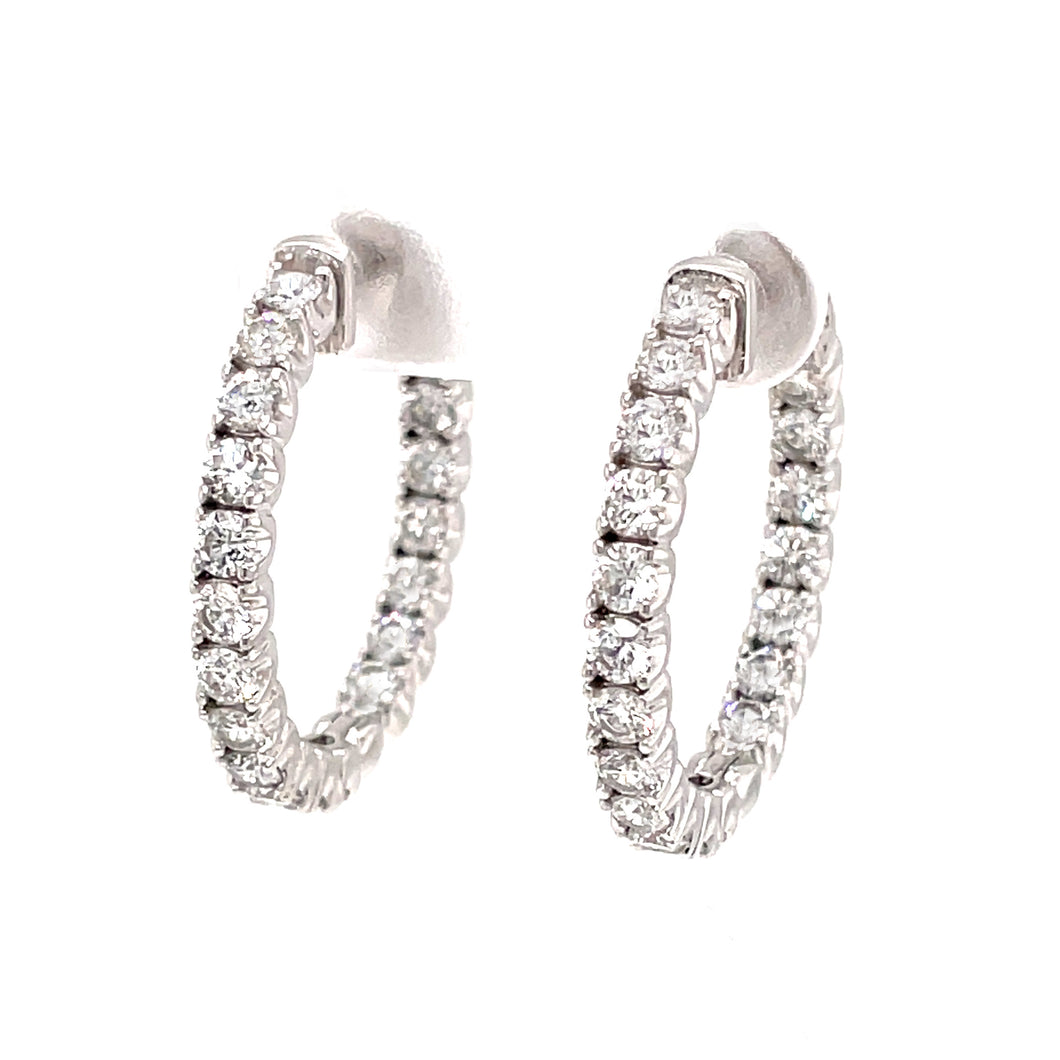 These classic hoops feature 38 inner and outer diamonds totaling 2....