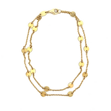 This easy to style 14k yellow gold double strand bracelet measures ...