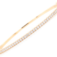 This classic bangle features 45 round brilliant cut diamonds, half ...