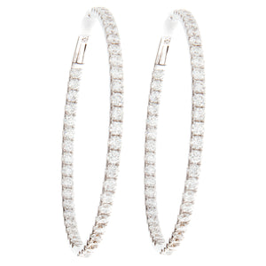 Classic white gold hoops with diamonds on the inside and outside of...