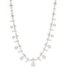 This elegant necklace features 245 prong-set and bezel set diamonds...