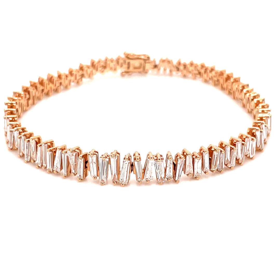 This gorgeous tennis style bracelet features baguette cut diamonds ...