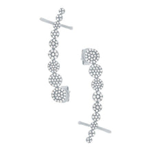 These diamond ear crawlers feature pave set round brilliant cut dia...
