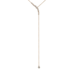 This lariat necklace features round brilliant cut diamonds that tot...