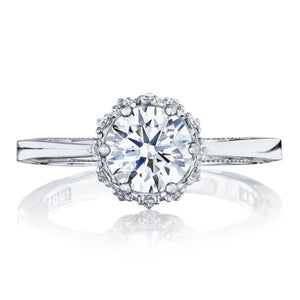 Let this brilliant round diamond take center stage! The aerial pers...