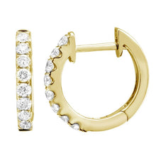 These diamond huggy earrings features .18cts of round brilliant cut...