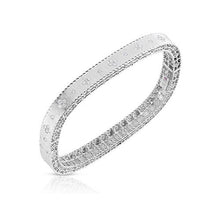 This diamond bangle features round brilliant cut diamonds that tota...
