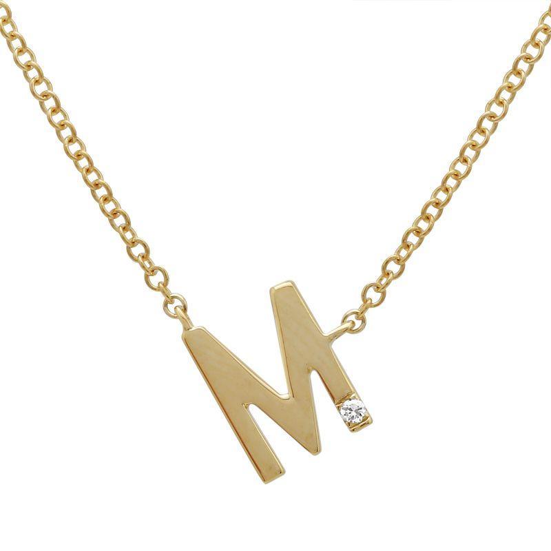 This necklace features an initial set with a round brilliant cut di...