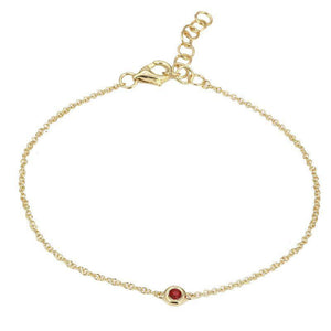 This bracelet features a bezel set ruby stone.