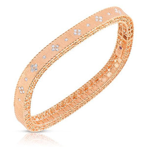 This diamond bangle features round brilliant cut diamonds that tota...