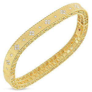 This diamond bangle features round brilliant cut diamonds that tota...
