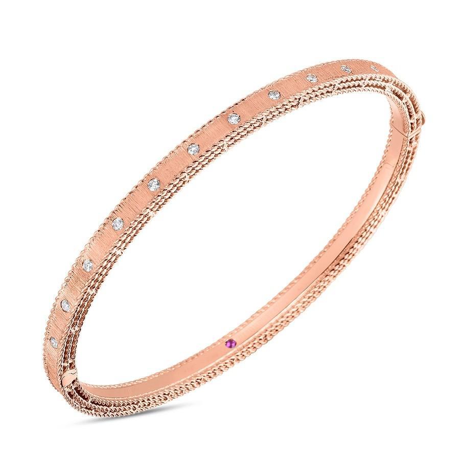 This bangle features pave set round brilliant cut diamonds that tot...