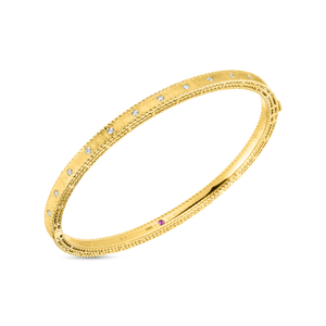 This bangle features pave set round brilliant cut diamonds that tot...
