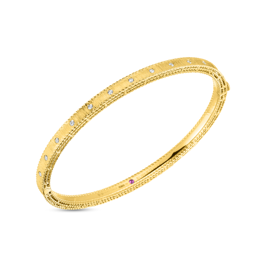 This bangle features pave set round brilliant cut diamonds that tot...
