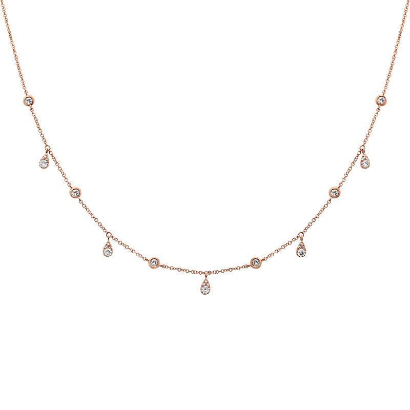 This necklace features round brilliant cut diamonds that total .18cts.