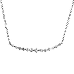 This diamond necklace features prong set round brilliant cut diamon...