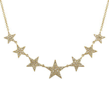 This gold star necklace features pave set round brilliant cut diamo...