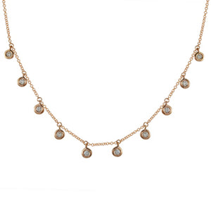 This diamond necklace features round brilliant cut diamonds that to...