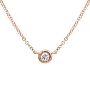 This necklace features a bezel set diamond that total totals .07cts.