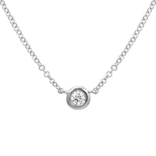 This necklace features a bezel set diamond that total totals .07cts.
