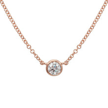 This necklace features a .12ct round brilliant cut diamond set in a...
