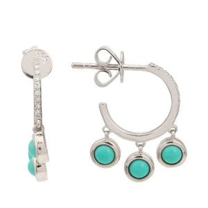 The earrings features turquoise drops.