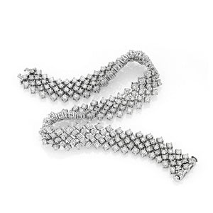 This diamond bracelet features round brilliant cut diamonds that to...
