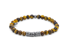 








Tiger eye beads are paired with hand-polished, black rhodi...