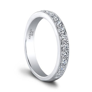 This diamond wedding band by Jeff Cooper features round brilliant c...