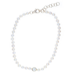 this pearl bracelet features a bezel set diamond totaling .10ct