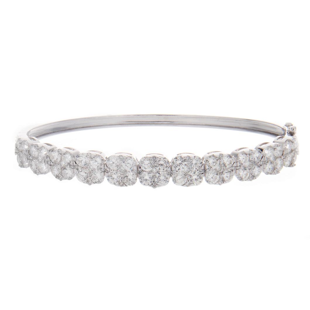 this classic bangle features round brilliant cut diamonds totaling ...