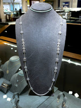 This stunning 18k white gold diamond necklace features round brilli...