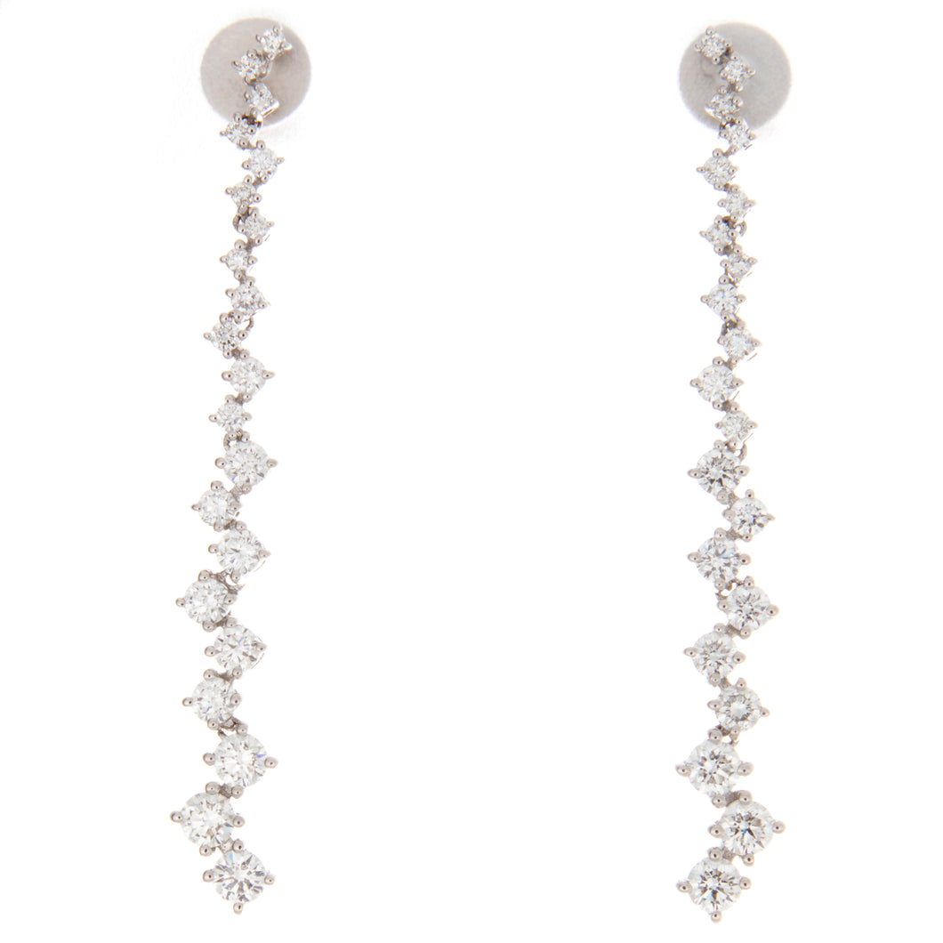 Stunning 18k white gold earrings featuring brilliant cut diamonds t...