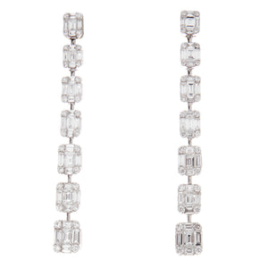 These elegant 18k white gold drop earrings feature 56 brilliant cut...