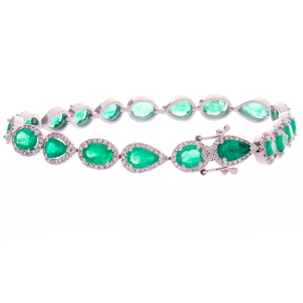 This bright bracelet features emeralds in oval and pear shapes tota...
