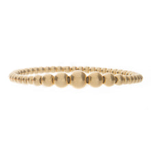 stretch bracelet with 18k gold beads gradual sizes. available in ye...