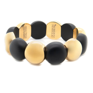 This double coil stretch bracelet features matte black ceramic with...