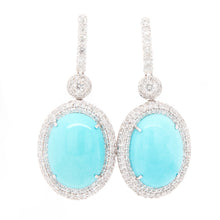 these 18k white gold drop earrings feature turquoise center stones ...
