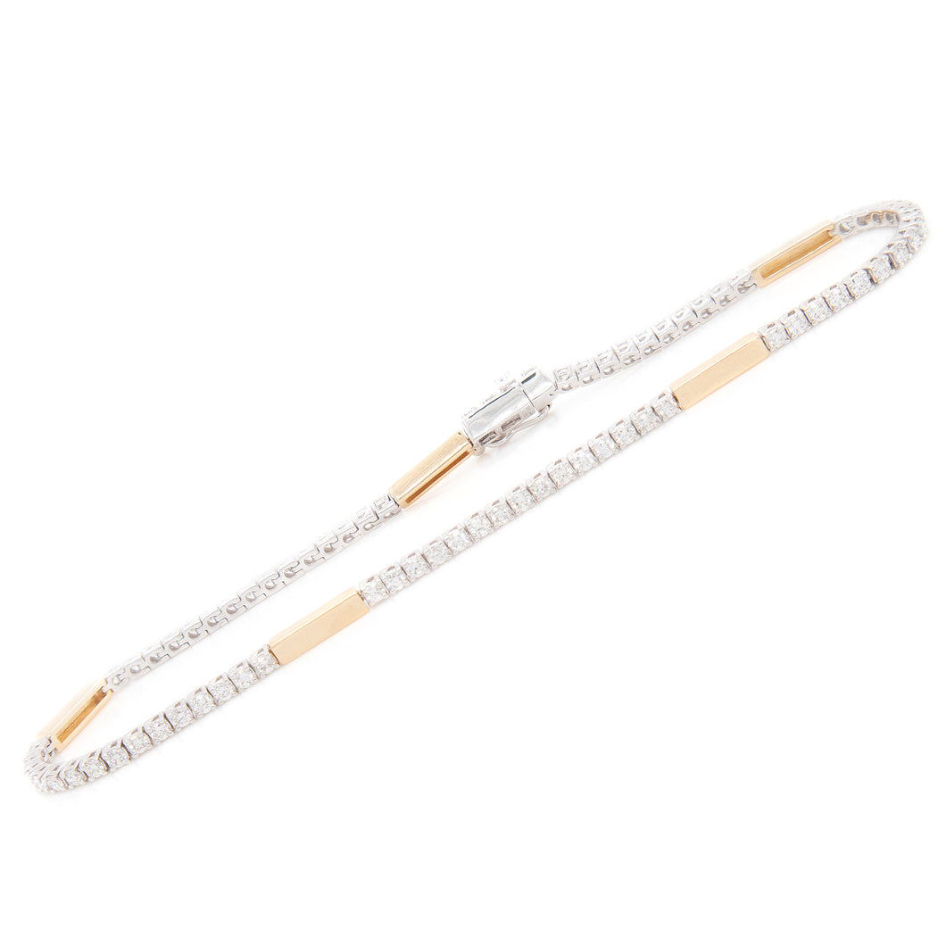 This classic white and yellow gold bracelet features diamonds all t...