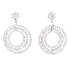 The stunning earrings feature 178 round brilliant cut diamonds in t...