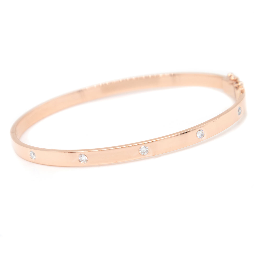This bangle features 5 round brilliant cut diamonds totaling .25ct....