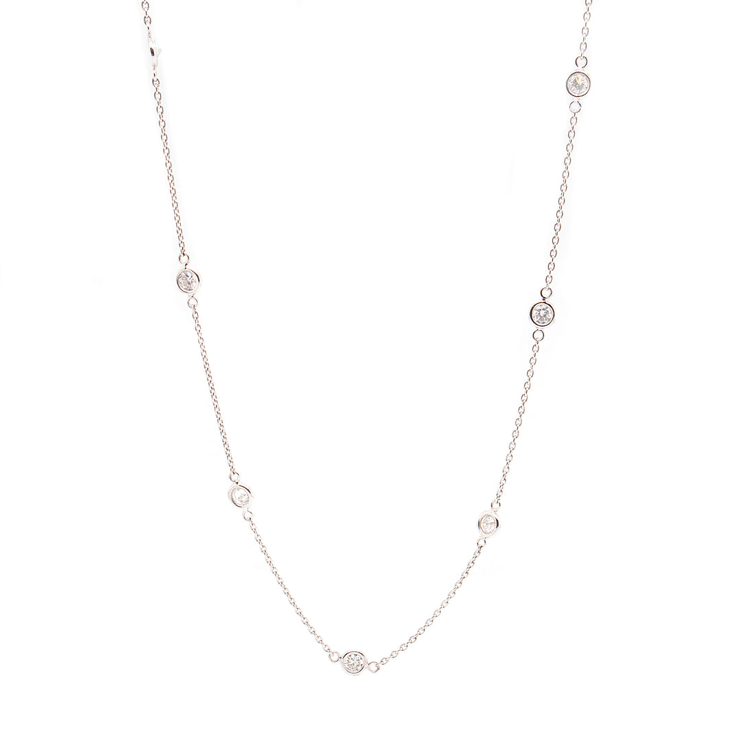 This diamond by the yard necklace features 10 bezel set diamonds to...