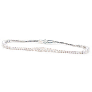 Tennis style bracelet with diamonds in varying sizes totaling appro...