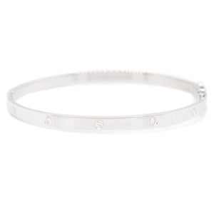 This bangle features 5 round brilliant cut diamonds totaling .25ct....