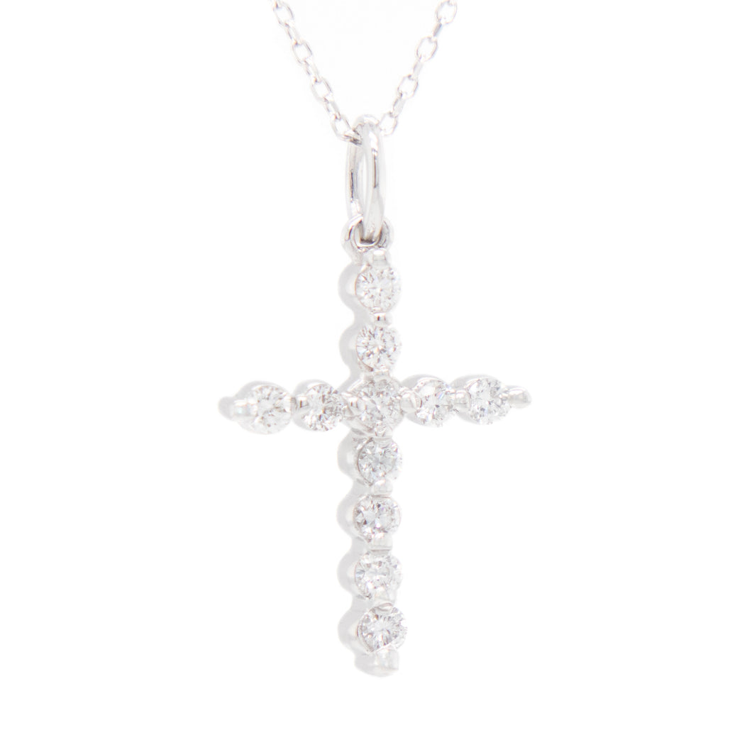 this necklace features a cross pendant featuring 11 round brilliant...