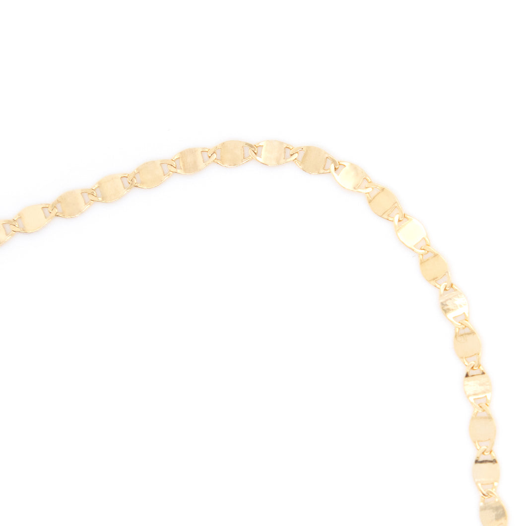 flat lay anklet in yellow gold.