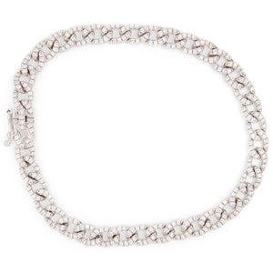 classic link bracelet with pace-set diamonds on each link. Diamonds...