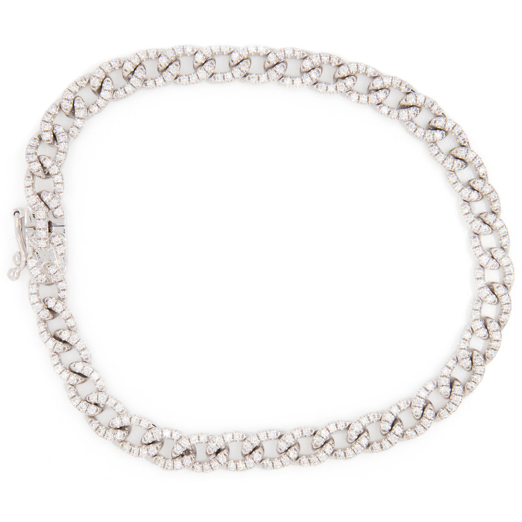 classic link bracelet with pace-set diamonds on each link. Diamonds...
